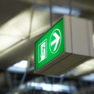 Green fire exit sign close-up